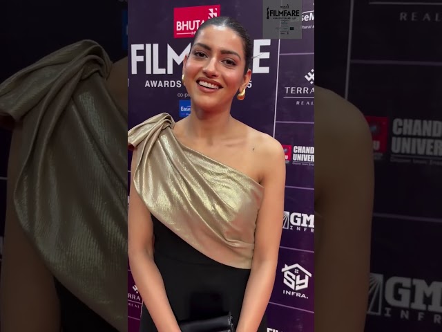Naiqra stunned in a black and gold gown on the