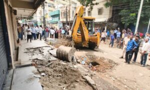 1758545703 GHMC demolishes street vendors stalls for road widening near Khaja