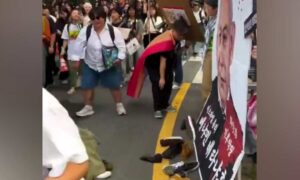 1759054414 Shoes thrown at Netanyahu poster during Gaza protest in Seoul