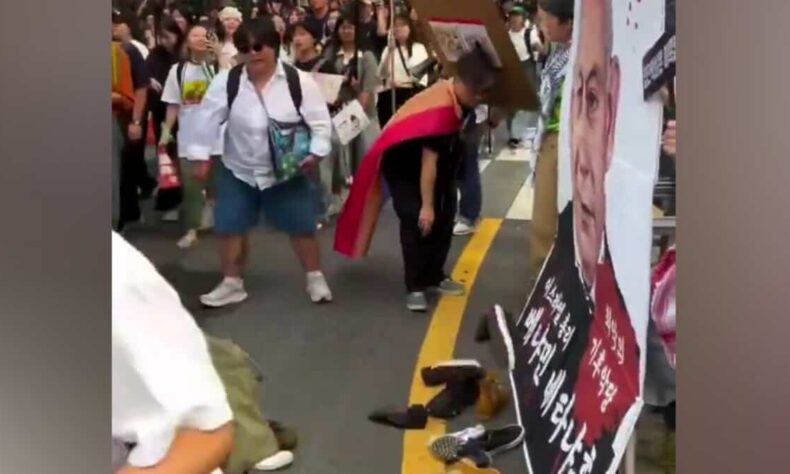 1759054414 Shoes thrown at Netanyahu poster during Gaza protest in Seoul