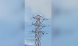 1759673166 Drunk man climbs electric pole over financial dispute