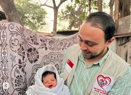 Gaza couple names newborn Singapore in honour of aid workers