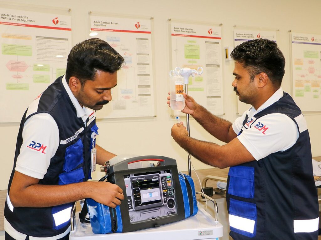 Abhijith Jees and Ajeesh Nelson preparing medical equipment at Response Plus Medical, UAE.