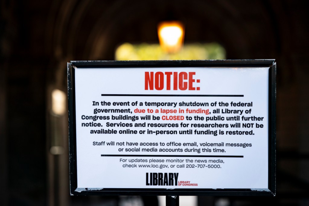 WASHINGTON, DC - OCTOBER 1: A sign indicating that the Library of Congress is closed due to the government shutdown, on October 1, 2025 in Washington, DC. Congress could not agree on a budget to fund government at midnight, causing the first shutdown since 2018. (Photo by Al Drago/Getty Images)