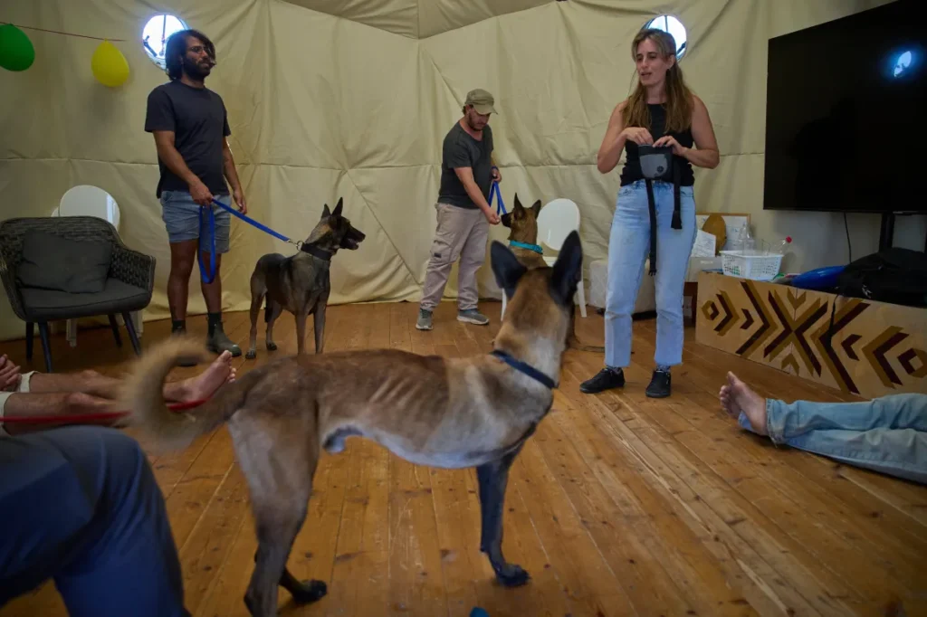 Israeli soldiers attend a dog-assisted therapy session at the Back2Life farm in Kibbutz Sdot Yam, central Israel.