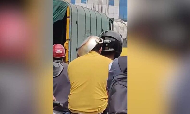 Man covers head with kadai to dodge Bengaluru traffic challan